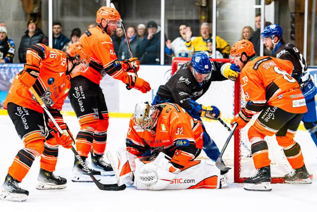 NO WAY THROUGH: Sheffield Steeldogs' goaltender Alex Oldale smothers the puck to thwart a Leeds Knights attack during Sunday night's derby encounter at The Castle. Picture: Kev Bland/Knights Media.