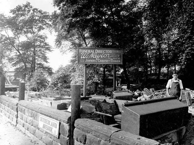 Sutherland Avenue in August 1939.Located at the junction with Street Lane, premises of William Naylor , joiner and undertaker. Building materials can be seen around the yard. A young boy in overalls is on the right.