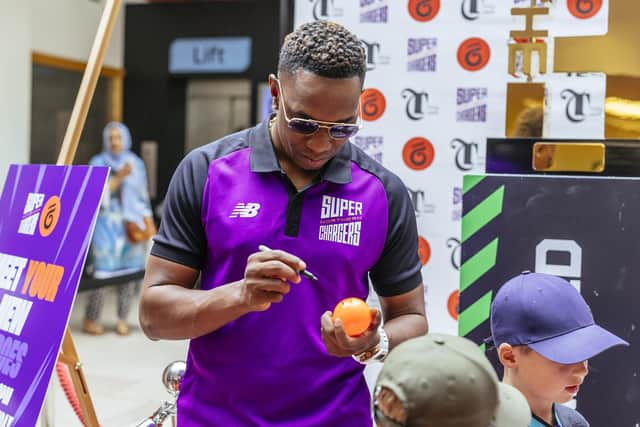 Dwayne Bravo signs an autograph at Rola Wala in Leeds. Picture by Northern Superchargers/Hatch PR.