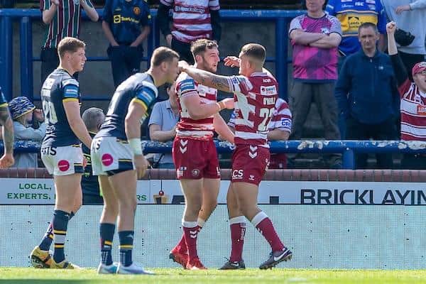 Disappointment for Rhinos' Morgan Gannon and Harry Newman as Wigan's Jake Wardle celebrates his winning try in last weekend's Cup tie. Picture by Allan McKenzie/SWpix.com.
