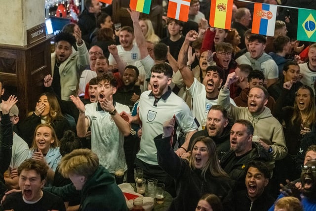 Fans crowded beneath the television screens at Beckett's Bank to watch the Group B opening match.