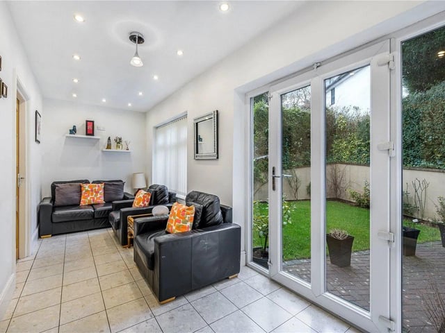 The conservatory has underfloor heating and a door to the rear garden