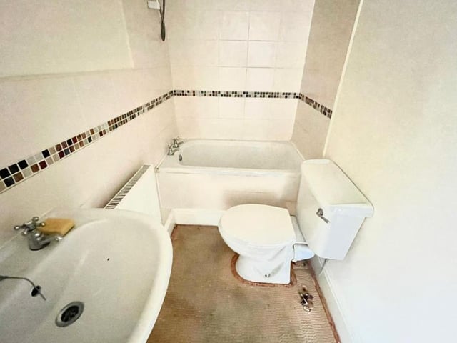 Here is the bathroom, which sits on the first floor of the Carlton Street property. A white suite comprises bath, wash hand basin and low-flush WC.