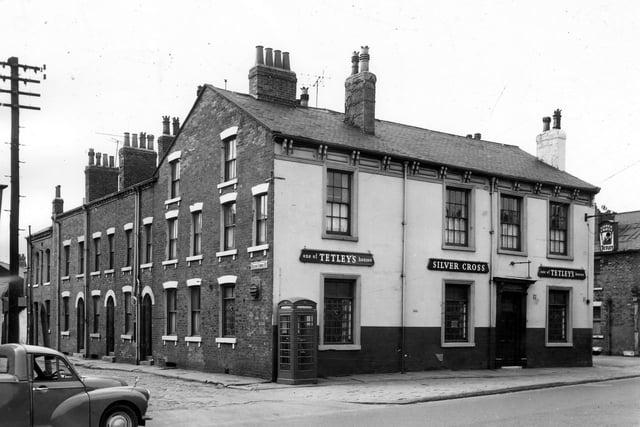The Silver Cross Hotel on Dewsbury Road. It is located between the junctions of Silver Cross Street left (where William Wilson had his first Silver Cross Pram factory) and Derby Crescent, right. The Silver Cross Hotel is one of Tetley's Houses.