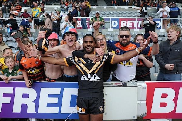 Jason Qareqare, who scored the crucial try, celebrates with Castleford Tigers fans after the win over Leeds.