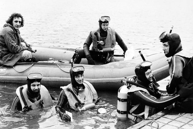 The British Sub Aqua Club in Yorkshire staged a treasure hunt in Waterloo Lake in March 1974.  Pictured checking the equipment before making a dive are, from left, D. McIntyre, N. Hall, H. Pearson and D. Child, all members of the Leeds branch of the British Sub Aqua Club.