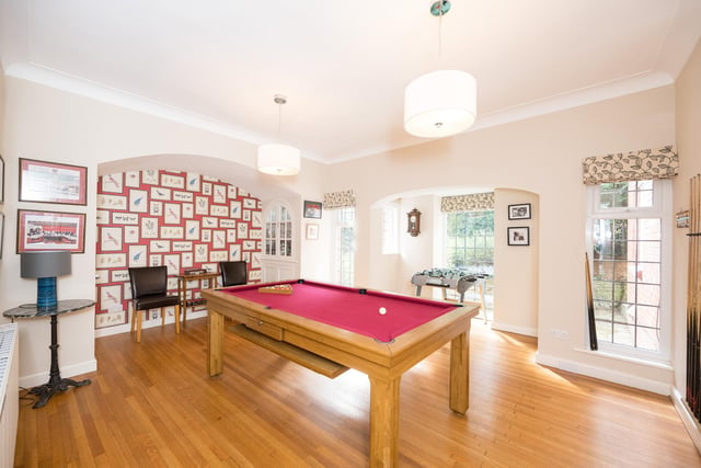 This games room has plenty of natural light pouring in through the large windows.