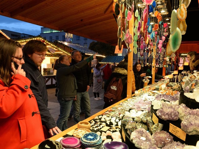 Here visitors to the market in 2017 browse the goods on sale, ranging from trinkets to decorative pots for the perfect Christmas gift.