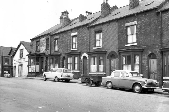 Oatland Lane in August 1967. On the left is Servia Grove with a branch of Leeds Co-operative stores. The white building was formerly a gymnasium. This was the end of Servia Road. Oatland Lane joined here with number 136, the bay window has been painted over. Then moving right are numbers 134, 132, 130 and 128 in descending order. Oatland Lane was previously known as Camp Road, this was the upper part of it; the lower part remained Camp Road for some time but is now Lovell Park Road.