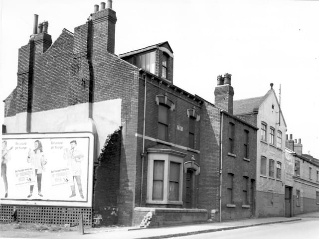 Towards the left of this view from June 1965 is number 111 Tong Road with a bay window. There is a date stone between the upper windows which states 'Douglas House 189?'. Moving right, number 113, then the entrance to Unidec Confectionery factory, previously the premises of Tong Road Mill.