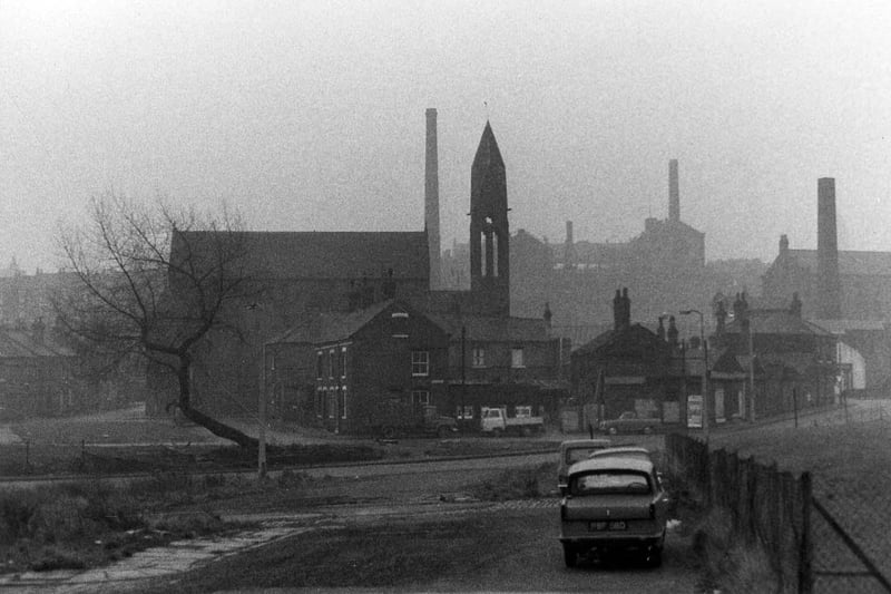 Looking towards Woodhouse Carr from Langset Street, showing a cleared area in the foreground, the Church of the Holy Name on Cambridge Road in the middle distance and Bagby Mill on Servia Hill on the horizon. Pictured in 1970.