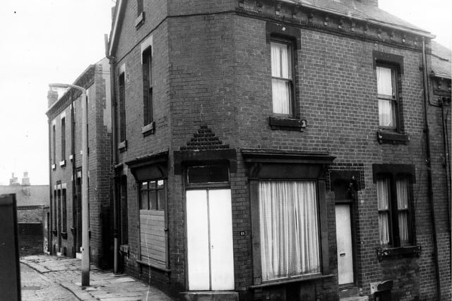 On the left of the image from May 1971 is Gayle's Place with Greenmount Street at the corner. The window on the left of this shop front is boarded over.