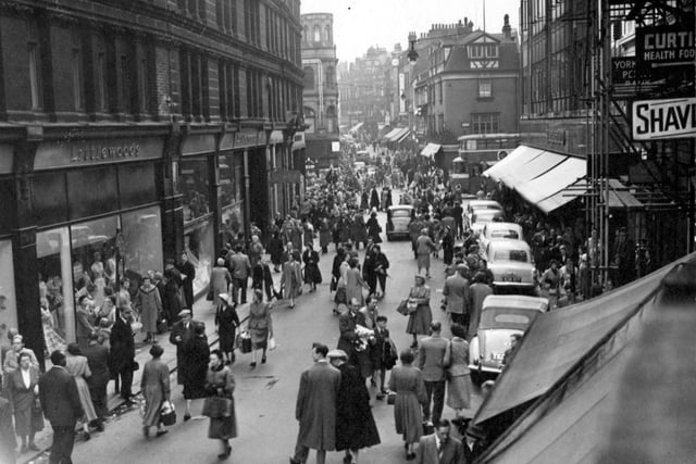 Looking west along Kirkgate towards Briggate in July 1956. The side entrance to Littlewoods, the Department Store is visible on the left. The front entrance is on Briggate with an address of 128 to 132 Briggate. A few years ago the Littlewoods store closed down and Marks & Spencer opened a Menswear department there for a brief period. Yorkshire Penny Bank is on the right of the image at numbers 8-9 Kirkgate next to the entrance to Fish Street.