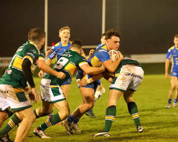 Leeds Rhinos' Harrison Gilmore is tackled during this year's Harry Jepson Trophy tie at Hunslet. Picture by John Victor.
