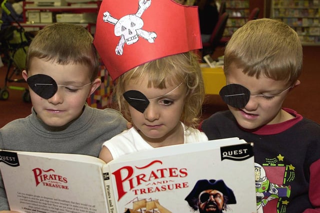 Why are pirates, pirates? Because they aaaarh! Triplets Alex, Lisa and Thomas Grant dressed up for the part at Crossgates Library during the half-term break in November 2001.