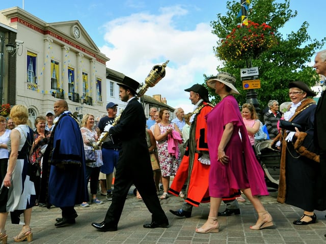 Some of the Yorkshire Mayors ,Dignitries and VIP's walk past the Town Hall in the market square in Ripon parading to the cathedral on Yorkshire Day.