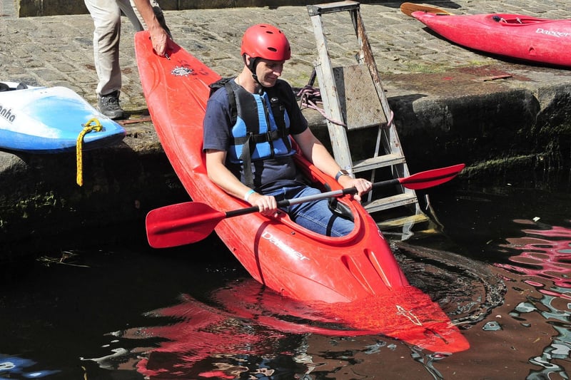 James Dunkley of Horsforth slides into the water to try his hand at canoeing. (pic by Steve Riding)