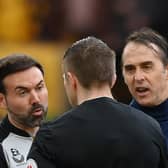 WOLVERHAMPTON, ENGLAND - MARCH 18: Julen Lopetegui, Manager of Wolverhampton Wanderers and Ruben Neves clash with Referee Michael Salisbury after the team's defeat in the Premier League match between Wolverhampton Wanderers and Leeds United at Molineux on March 18, 2023 in Wolverhampton, England. (Photo by Shaun Botterill/Getty Images)