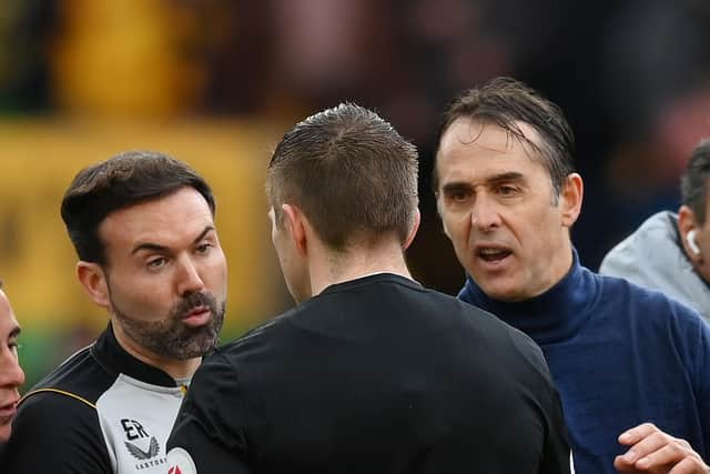 WOLVERHAMPTON, ENGLAND - MARCH 18: Julen Lopetegui, Manager of Wolverhampton Wanderers and Ruben Neves clash with Referee Michael Salisbury after the team's defeat in the Premier League match between Wolverhampton Wanderers and Leeds United at Molineux on March 18, 2023 in Wolverhampton, England. (Photo by Shaun Botterill/Getty Images)