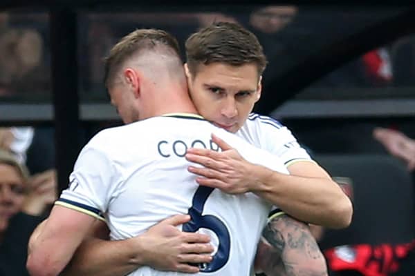 Leeds United's Austrian defender Maximilian Wober (R) embraces Leeds United's English-born Scottish defender Liam Cooper(L) as he replaces him during the English Premier League football match between Bournemouth and Leeds United (Photo by STEVE BARDENS/AFP via Getty Images)