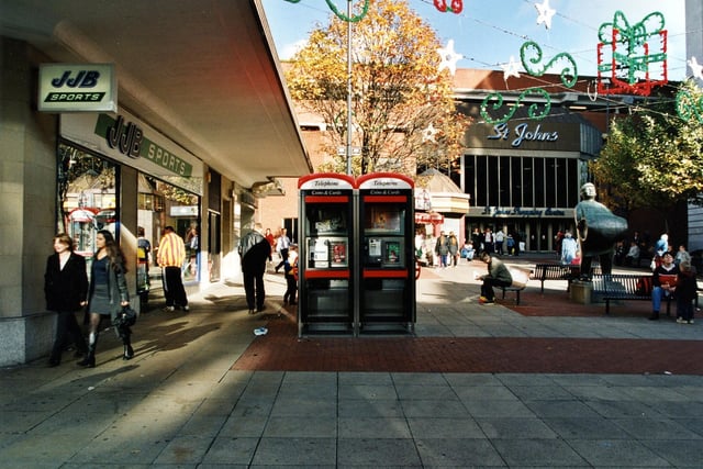 Dortmund Square, so called because of the Bronze statue of the Dortmund Drayman by Arthur Schults Engels which was presented in 1980 to celebrate the 10th year of Civic twinning. Telephone boxes can be seen in the centre of the photograph with JJB Sports on the left.