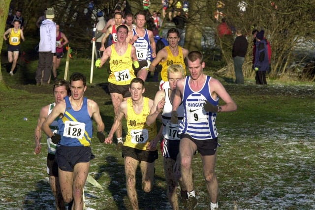 The Nike Yorkshire County Cross Country Championships  at Nunroyd Park, Guiseley, with the eventual winner Chris Cariss of Bingley Harriers (9), right, leading the second-placed Martin Hilton (128), from Leeds City Athletic Club, pictured on January 4, 2003.