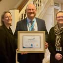 The St John's Catholic Specialist School team with their accreditation.
