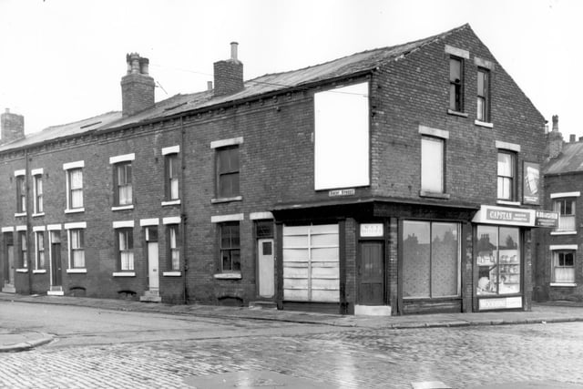 The junction of Ascot Street and Pontefract Lane. On the right is K Bransfield greengrocers & provisions sellers of Capstan and Woodbine Cigarettes. On the wall above the shop door is an advertisement for Detol. Pictured in October 1966.
