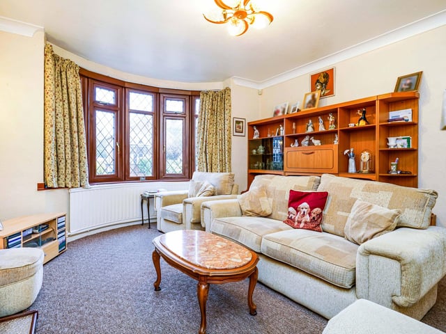The property boasts a spacious layout with a living room and separate dining room on the right.