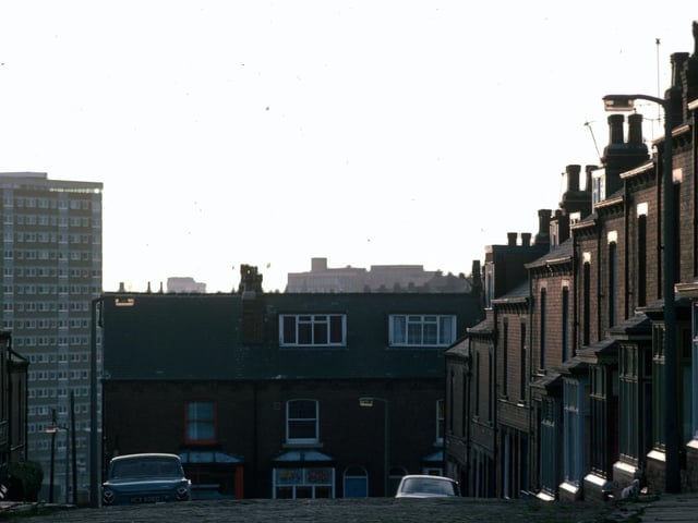 Looking south down Glossop Terrace towards Rider Road in Woodhouse in January 1976. In the background, left, are the high-rise flats of Holborn Towers.