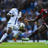 INTERNATIONAL TREBLE: For Dominic Poleon, left, pictured in action for Leeds United in the Championship clash against Queens Park Rangers at Elland Road of August 2013 and battling it out with Nedum Onuoha. Photo by Laurence Griffiths/Getty Images.