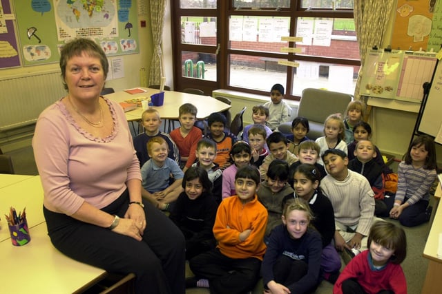 Head teacher Ann Philips with pupils at Cross Flatts Park Primary which was the most improved school in Leeds. Pictured in December 2001.