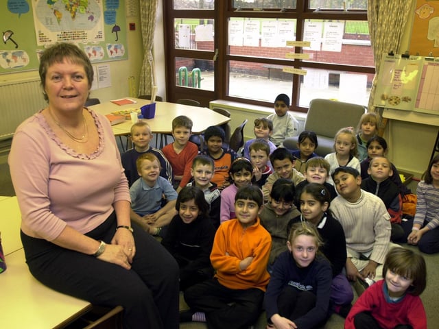 Head teacher Ann Philips with pupils at Cross Flatts Park Primary which was the most improved school in Leeds. Pictured in December 2001.