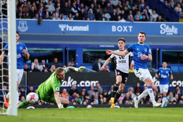 LIVERPOOL, ENGLAND - APRIL 15: Daniel James of Fulham scores the team's third goal past Jordan Pickford of Everton during the Premier League match between Everton FC and Fulham FC at Goodison Park on April 15, 2023 in Liverpool, England. (Photo by Marc Atkins/Getty Images)