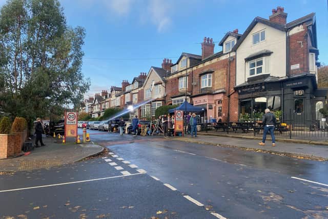 Film crews outside The Perfumed Garden, temporarily renamed Forget Me Not, in Chapel Allerton