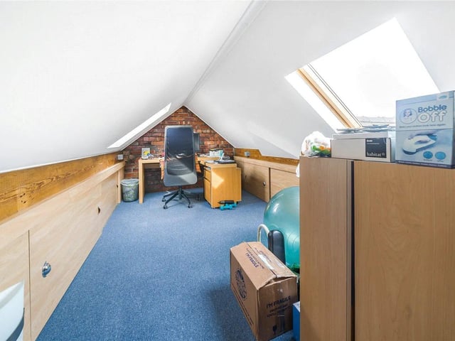 Upstairs there is also space for storage or a home office.