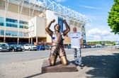 Leeds United fan Tony Clark, who owns Clark Sculptures based in Leeds, with his latest lifesize resin figure of Leeds United hero Billy Bremner celebrating after scoring against Wolves at Maine Road to put Leeds through to their second successive FA Cup Final 7th April 1973. Photo: James Hardisty