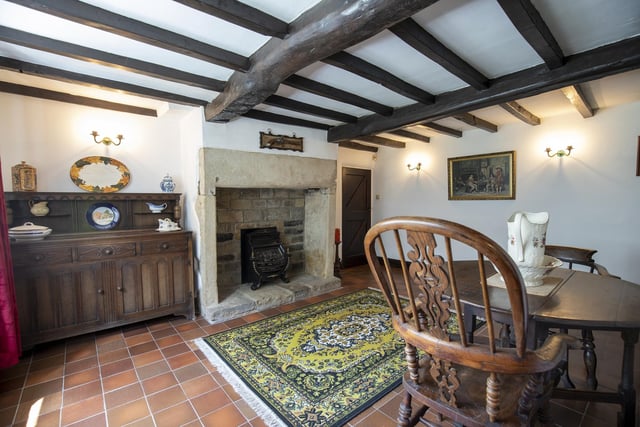 Beamed ceilings and stone fireplaces feature within the rooms.