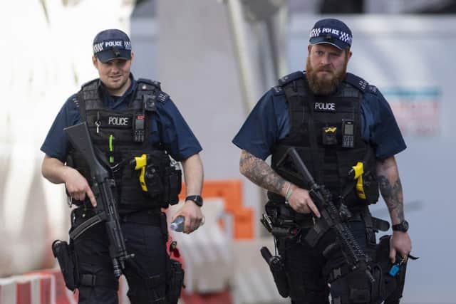 Armed police officers in action.