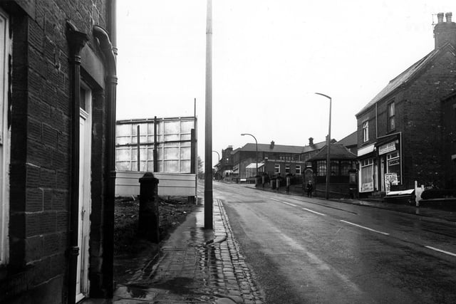 Looking south west along Elland Road in May 1980. The junction with Old Road is on the right, next to Diane Lesley, ladies hairdresser at no.34, with Pioneer Catering at no.32. Beyond Old Road is the war memorial, then the junction with William Street, and beyond this a social centre for the elderly.