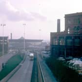 A view from the Inner Ring Road, on the footbridge near St. George's Church, looking towards Leeds International Pool on Westgate, centre background, in the spring of 1972. On the right is John Barran & Sons Ltd. clothing factory in Chorley Lane. The factory in the background, left is Bainbro House which housed the clothing manufacturing firm of Raper & Bainbridge Ltd. in Park Lane.