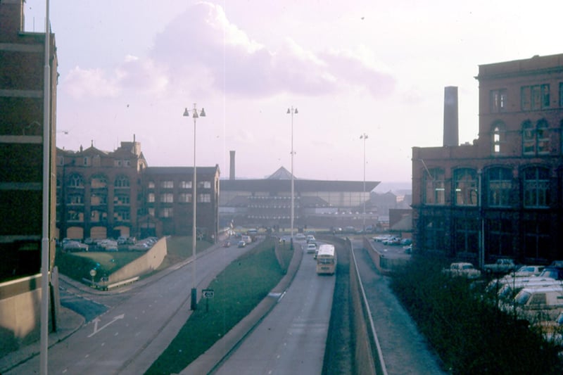 A view from the Inner Ring Road, on the footbridge near St. George's Church, looking towards Leeds International Pool on Westgate, centre background, in the spring of 1972. On the right is John Barran & Sons Ltd. clothing factory in Chorley Lane. The factory in the background, left is Bainbro House which housed the clothing manufacturing firm of Raper & Bainbridge Ltd. in Park Lane.