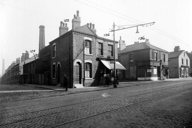 York Road in September 1935. From the left, Bickerdike Road, next shop with blind down, premises of I. Vellins and co, drapers, this is no.105. Then, junction with Bickerdike Street, empty shop on corner was I. Stephenson, butcher, no.105A. No.107 is William Wilkinson, selling sweets. The next street is Wright Street, with Joseph Harrison, plumber at no.109 and extreme right, J. Dean pork butcher, no.111. A tram stop is outside no.105.