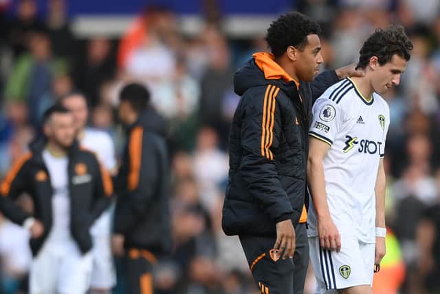 BITTER ENDING: Brenden Aaronson, right, is consoled by Whites team mate Tyler Adams, left, after Leeds United's relegation from the Premier League following the final game of the 2022-23 season at home to Tottenham Hotspur. Photo by Stu Forster/Getty Images.