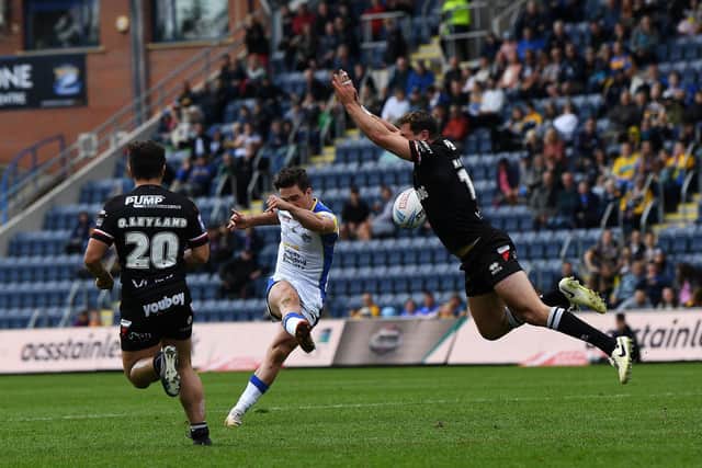 Brodie Croft lands a golden-point winning drop goal for Leeds Rhinos at home to London Broncos in July. He did the same in the away match two months later. Picture by Jonathan Gawthorpe.