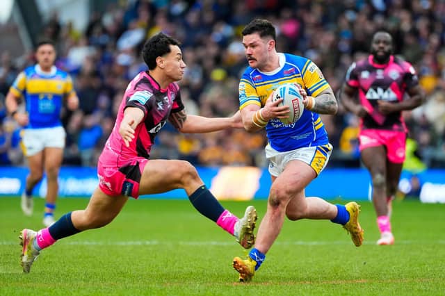 Leeds Rhinos' James Bentley takes of Daejarn Asi, of Castleford Tigers, during last week's derby. Picture by Olly Hassell/SWpix.com.
