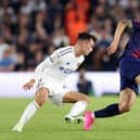 CHANCE SQUANDERED: Leeds United midfielder Jamie Shackleton, left, attends to West Brom's Okay Yokuslu during Friday night's 1-1 Championship draw between the Whites and Baggies at Elland Road. Photo by George Wood/Getty Images.