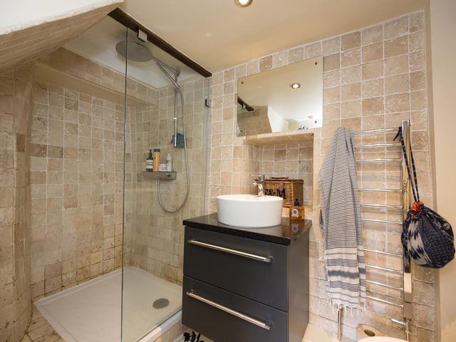 A fully tiled shower room is among the cottage facilities.