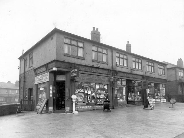 Shops on York Road in January 1936. This is close to the junction with Rookwood Avenue just off the photograph to the left. Properties seen at the rear are on Rookwood Avenue. Harold Sharp, chemist is at 534. Sign advertising National Health Insurance refers to pre 1948 National Health Service. In 1932 it was rudimentary insurance which only covered manual workers who contributed a small ammount of their wages for free medical advice. To the right is George C Audsley, Rookwood Post Office.