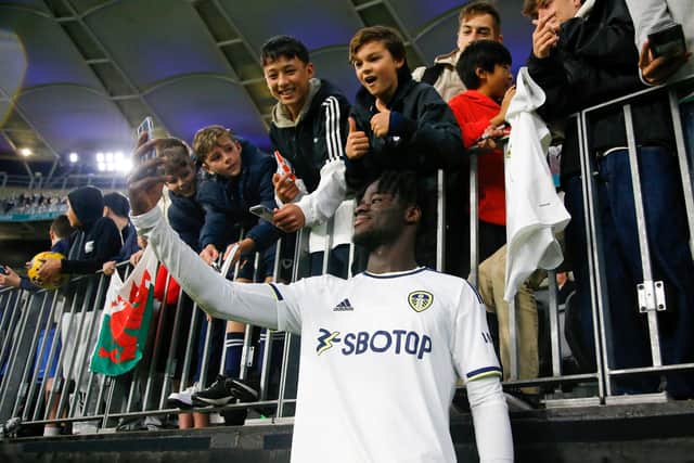 PERTH, AUSTRALIA - JULY 22: Darko Gyabi of Leeds United takes a selfie with the supporters during the Pre-Season friendly match between Leeds United and Crystal Palace at Optus Stadium on July 22, 2022 in Perth, Australia. (Photo by James Worsfold/Getty Images)